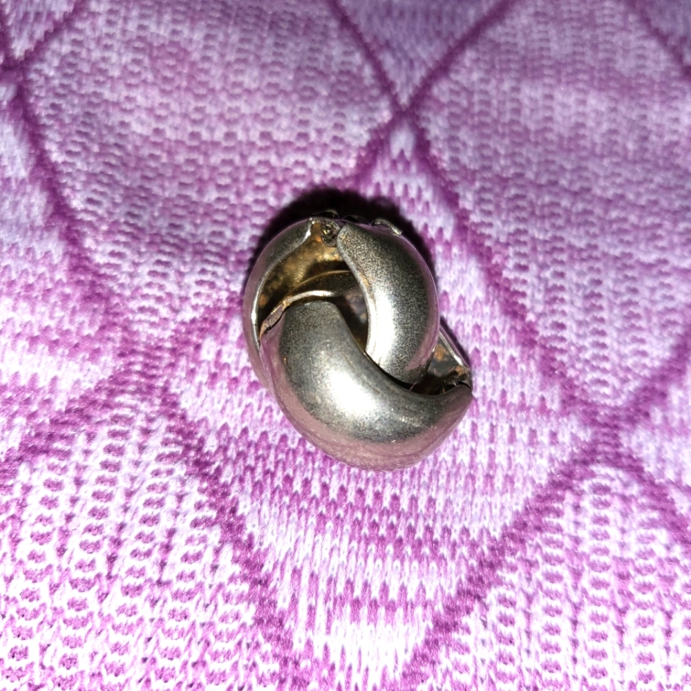 Very old clip on earrings. Silver and small. Nice and dainty.